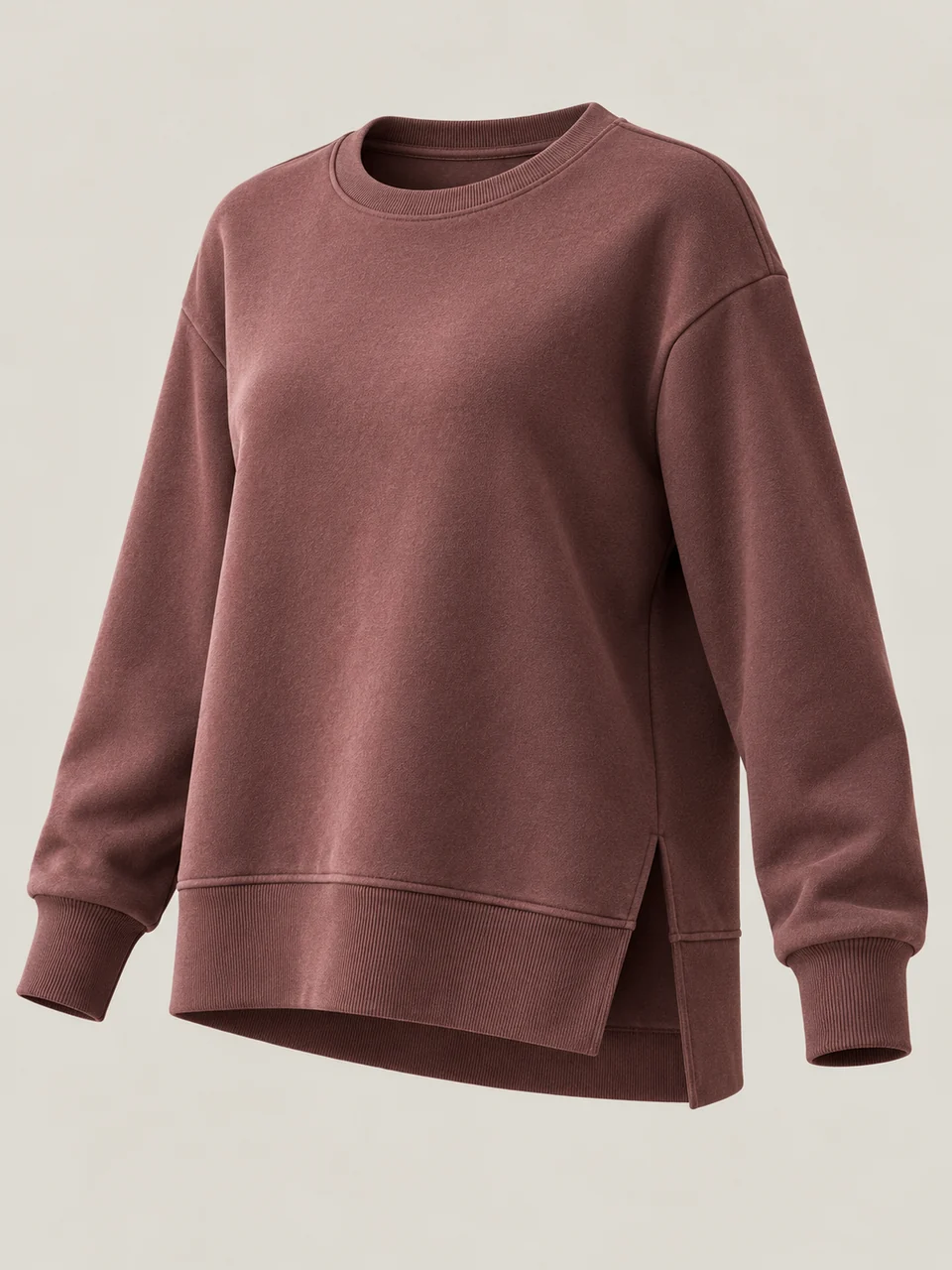 Brown relaxed pullover with a softly raised surface, ribbed cuffs and lower band, and a visible side opening