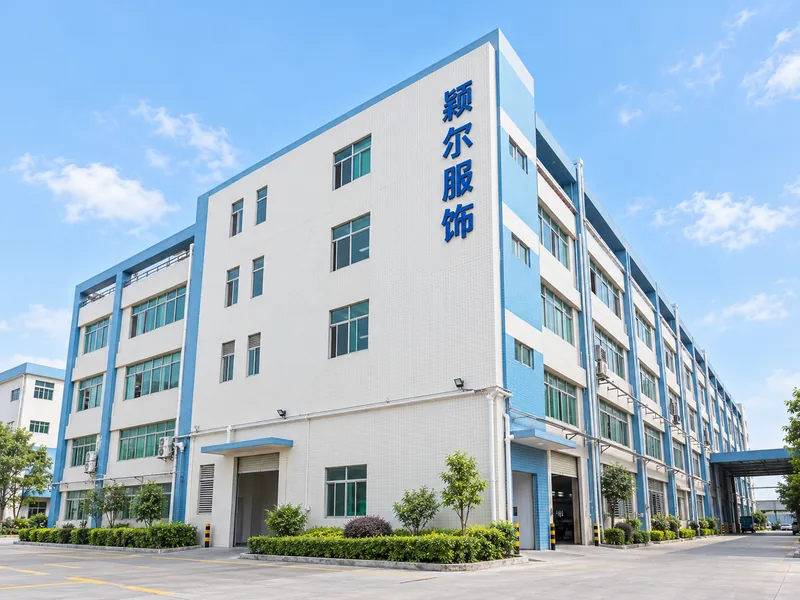 Factory exterior with the 颖尔服饰 sign